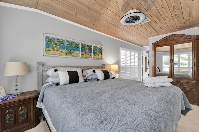 bedroom featuring multiple windows, wooden ceiling, and ornamental molding