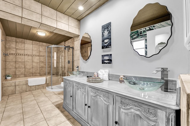 bathroom featuring vanity, wooden ceiling, tile patterned flooring, toilet, and walk in shower