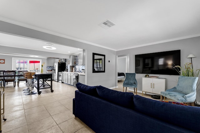 living room featuring crown molding and light tile patterned flooring