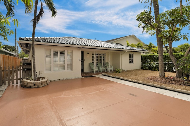 rear view of house with a patio area