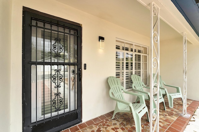 entrance to property with covered porch