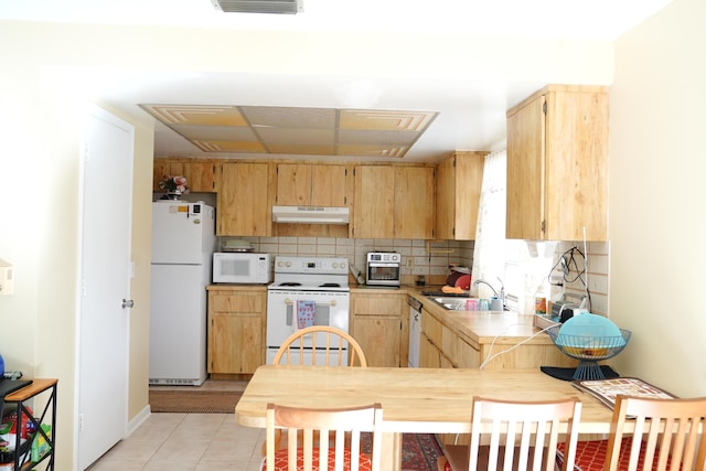 kitchen with light tile patterned floors, tasteful backsplash, white appliances, light brown cabinetry, and sink