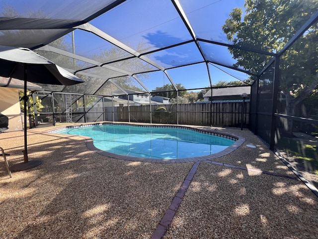 view of pool featuring a patio area and a lanai