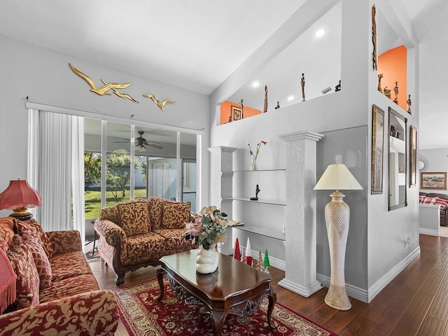 living room with ceiling fan and dark hardwood / wood-style flooring