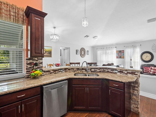 kitchen with pendant lighting, sink, stainless steel dishwasher, dark hardwood / wood-style floors, and tasteful backsplash