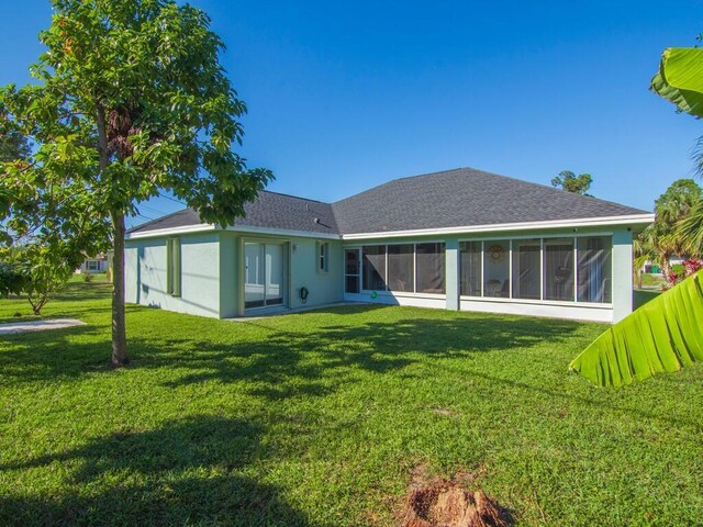 view of property exterior featuring a lawn and central AC unit