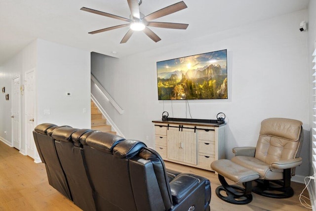 living room with hardwood / wood-style floors and ceiling fan