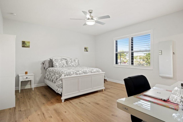 bedroom featuring light hardwood / wood-style flooring and ceiling fan