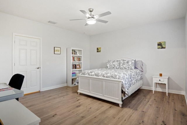 bedroom featuring hardwood / wood-style floors and ceiling fan