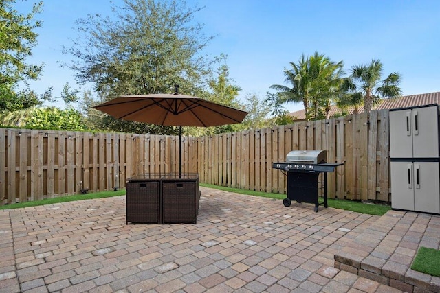 view of patio featuring a grill