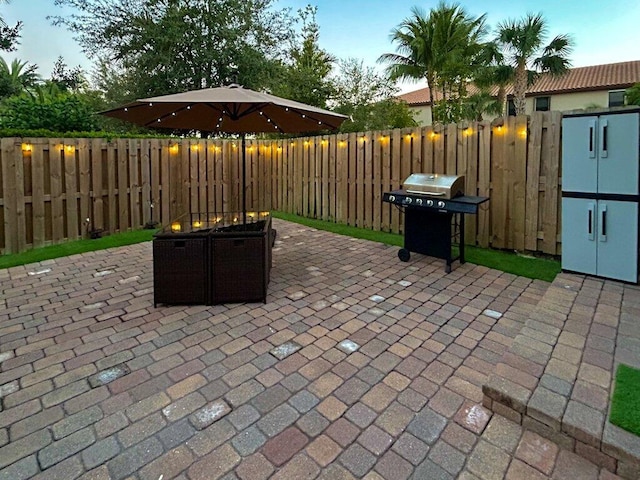 patio terrace at dusk with area for grilling