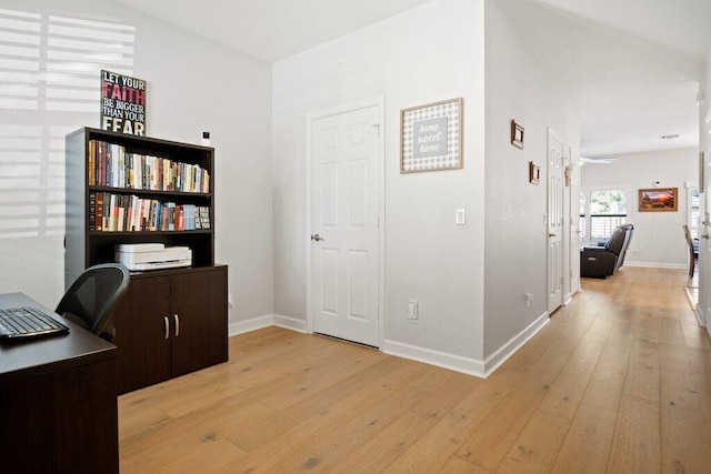 office featuring light hardwood / wood-style flooring and ceiling fan