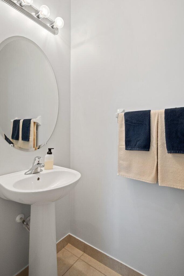 bathroom with tile patterned floors and sink