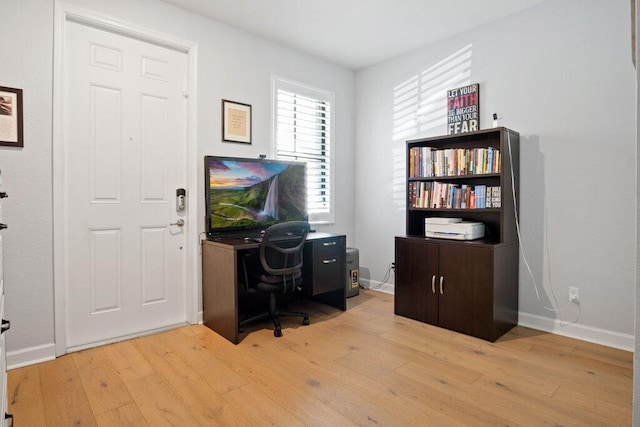 home office featuring light hardwood / wood-style floors