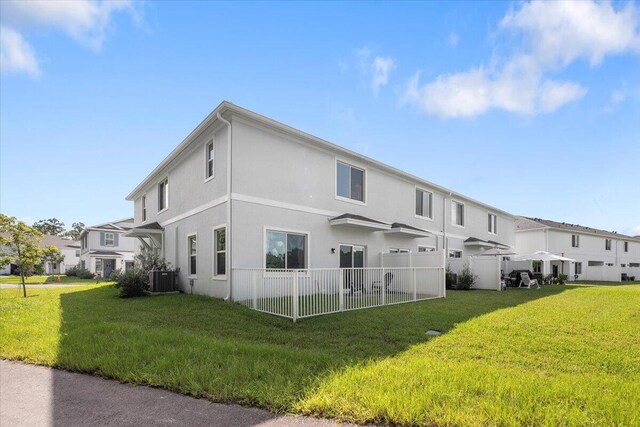 view of front of house with a garage and a front lawn