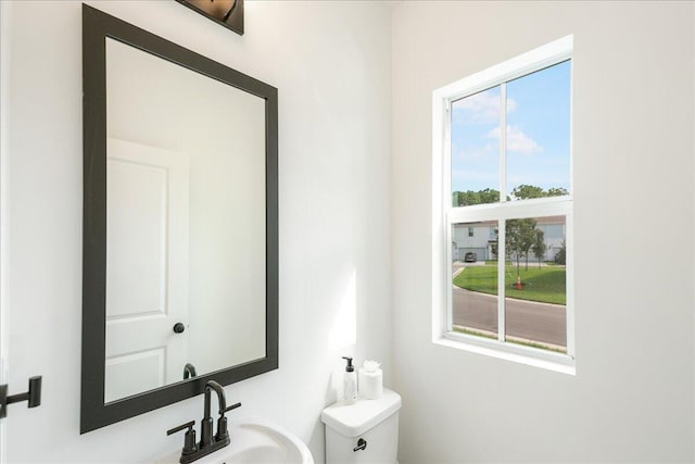 bathroom featuring sink and toilet