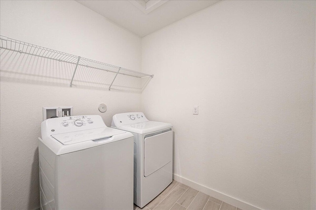 laundry room featuring separate washer and dryer