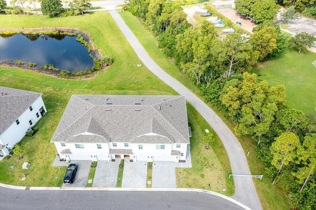 birds eye view of property with a water view