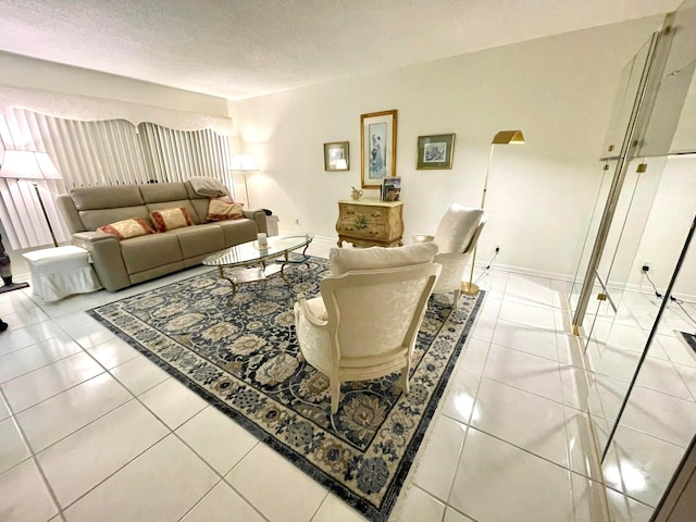 living room featuring light tile patterned floors and a textured ceiling