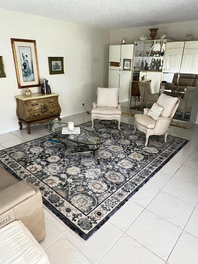 tiled living room with a textured ceiling