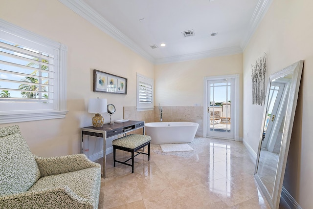 bathroom with a bathing tub and ornamental molding