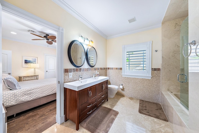 full bathroom with vanity, tile patterned floors, crown molding, ceiling fan, and tile walls