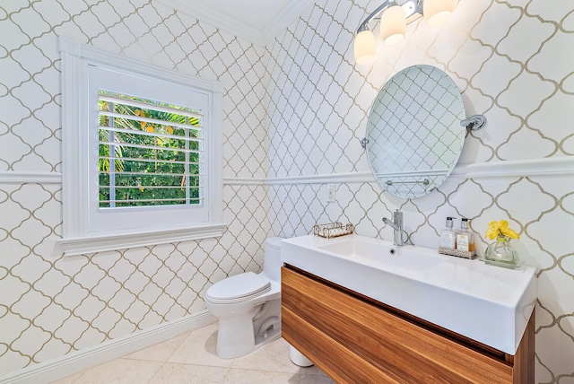 bathroom featuring vanity, toilet, and crown molding