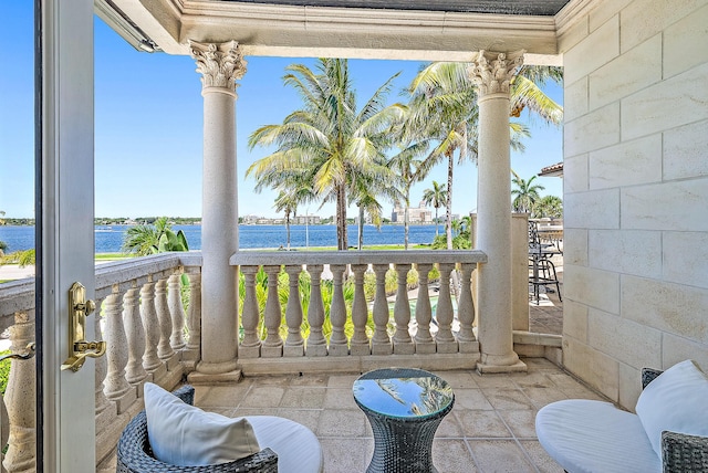 balcony featuring a water view