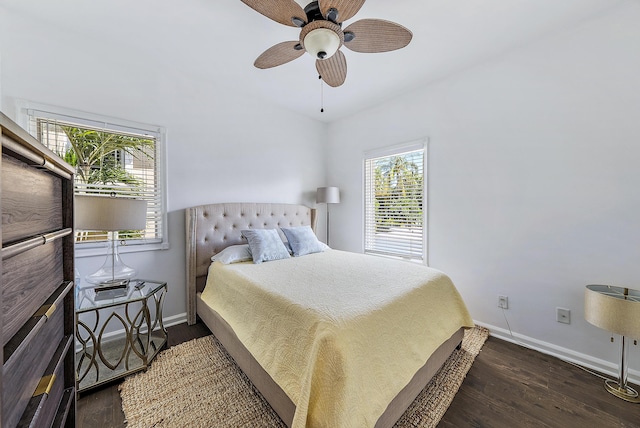 bedroom with ceiling fan and dark hardwood / wood-style flooring