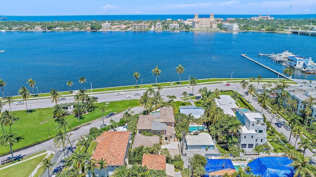 birds eye view of property with a water view