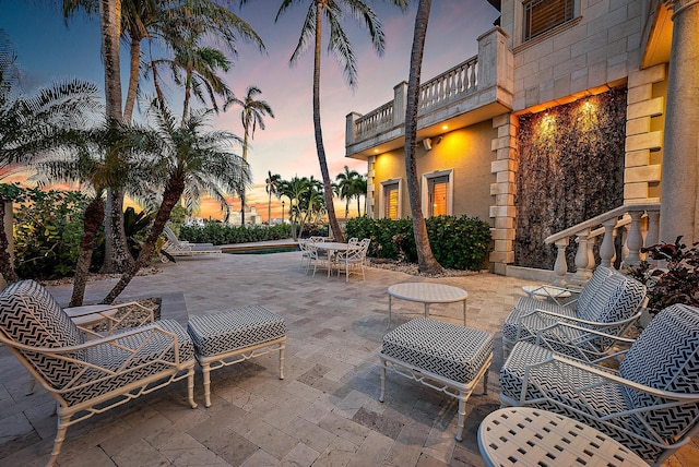 patio terrace at dusk with a balcony