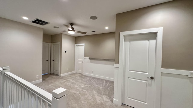 interior space with ceiling fan