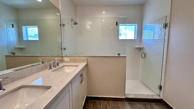 bathroom with vanity and an enclosed shower