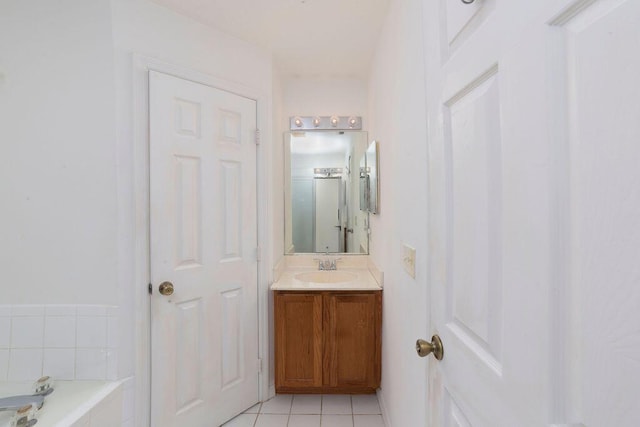 bathroom featuring tile patterned flooring, vanity, and plus walk in shower