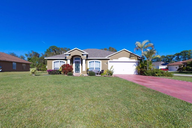 single story home featuring a garage and a front lawn