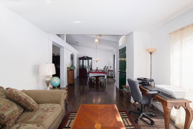 interior space featuring dark wood-type flooring and a notable chandelier