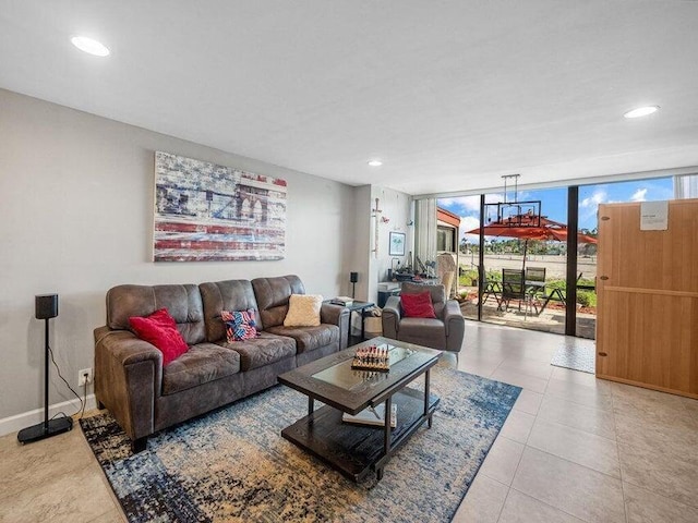 living room featuring floor to ceiling windows