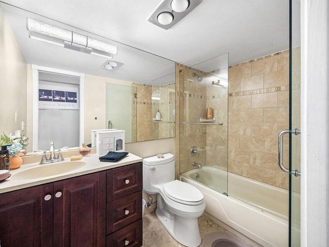 full bathroom with vanity, toilet, and shower / bath combination with glass door