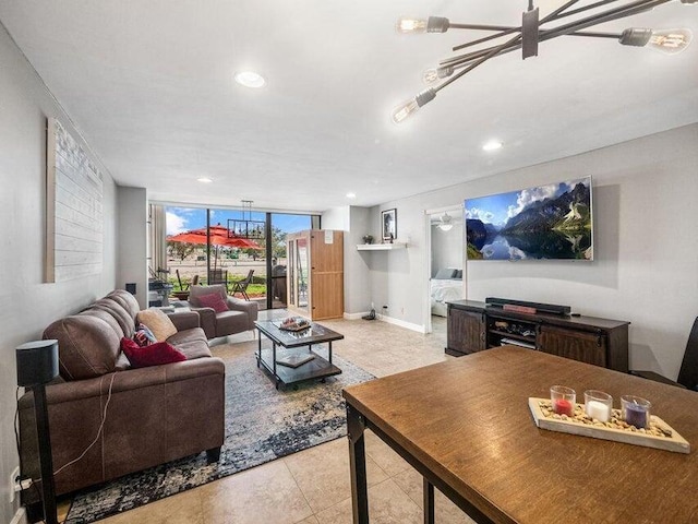 tiled living room featuring an inviting chandelier and floor to ceiling windows