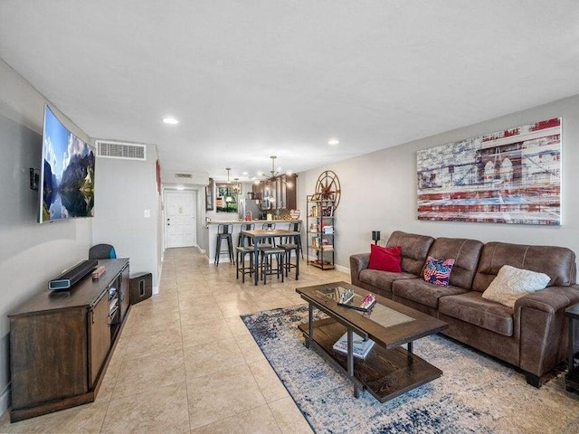 living room featuring an inviting chandelier