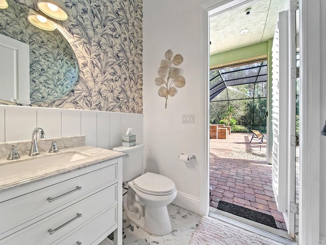 bathroom with toilet and vanity