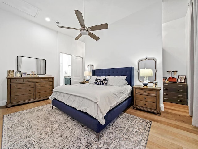 bedroom with ceiling fan and hardwood / wood-style flooring