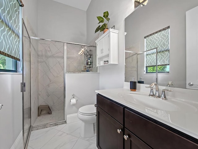 bathroom with walk in shower, vanity, and toilet