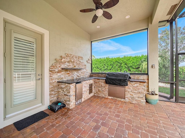 view of patio featuring ceiling fan and area for grilling