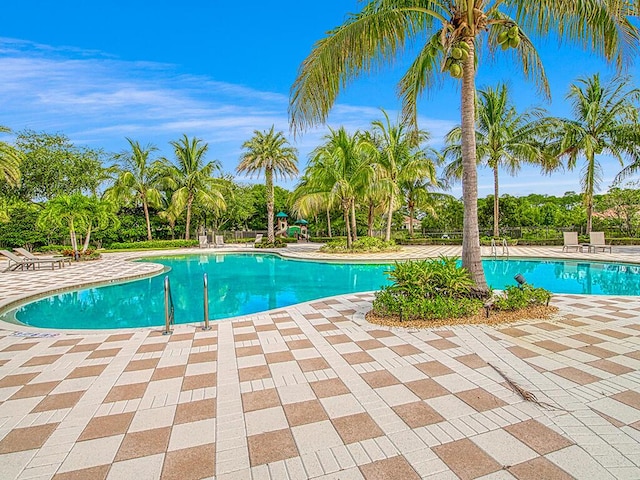 view of swimming pool featuring a patio area