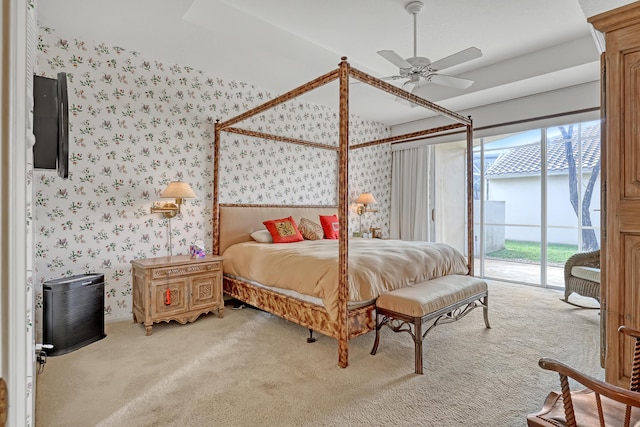 bedroom featuring carpet floors, ceiling fan, and access to exterior