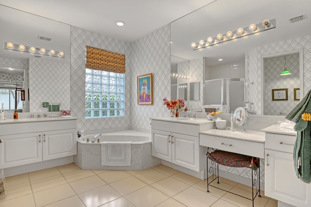 bathroom featuring tile patterned flooring, plus walk in shower, and vanity