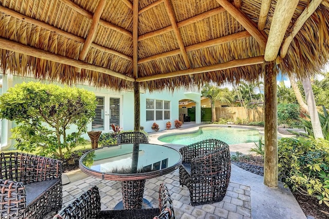 view of patio / terrace with a gazebo and a fenced in pool