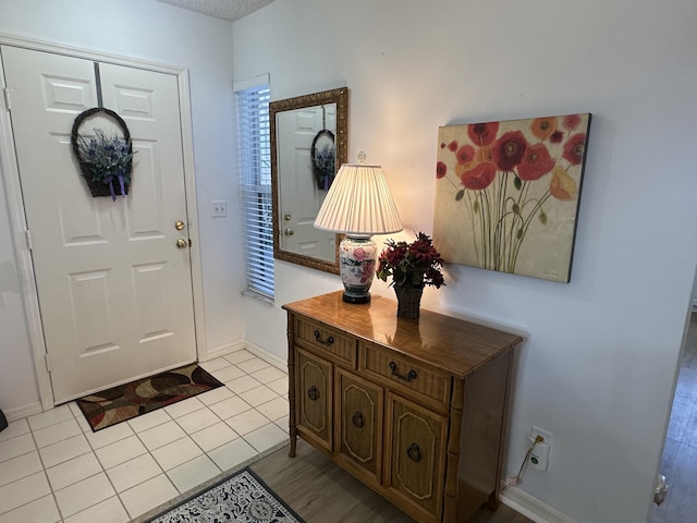 view of tiled foyer entrance