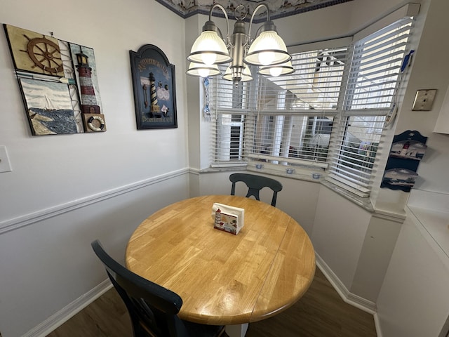 dining area featuring a chandelier and hardwood / wood-style floors